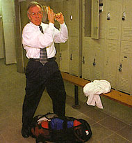 Businessman Roger Puckett, 62, prepares for the ring, under the watchful eye of trainer Paul Frediani